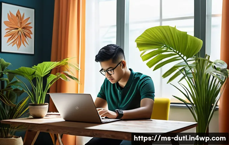 디지털 주의력 관리의 장단점 - A modern Malaysian home office scene showing a young Malay man focusing intently on his laptop, with...